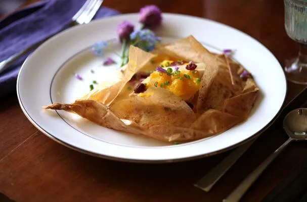 Salmone en Papillote con Mango e Arancia Suprema